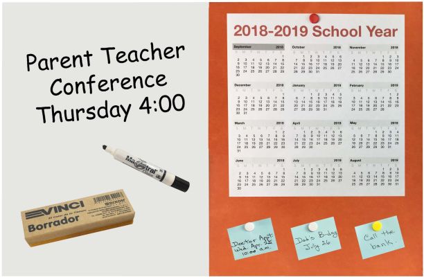 Soft Orange Medium Boards with School year calendar and handwritten reminders with push pins, appointments written with marker and eraser on dry erase side